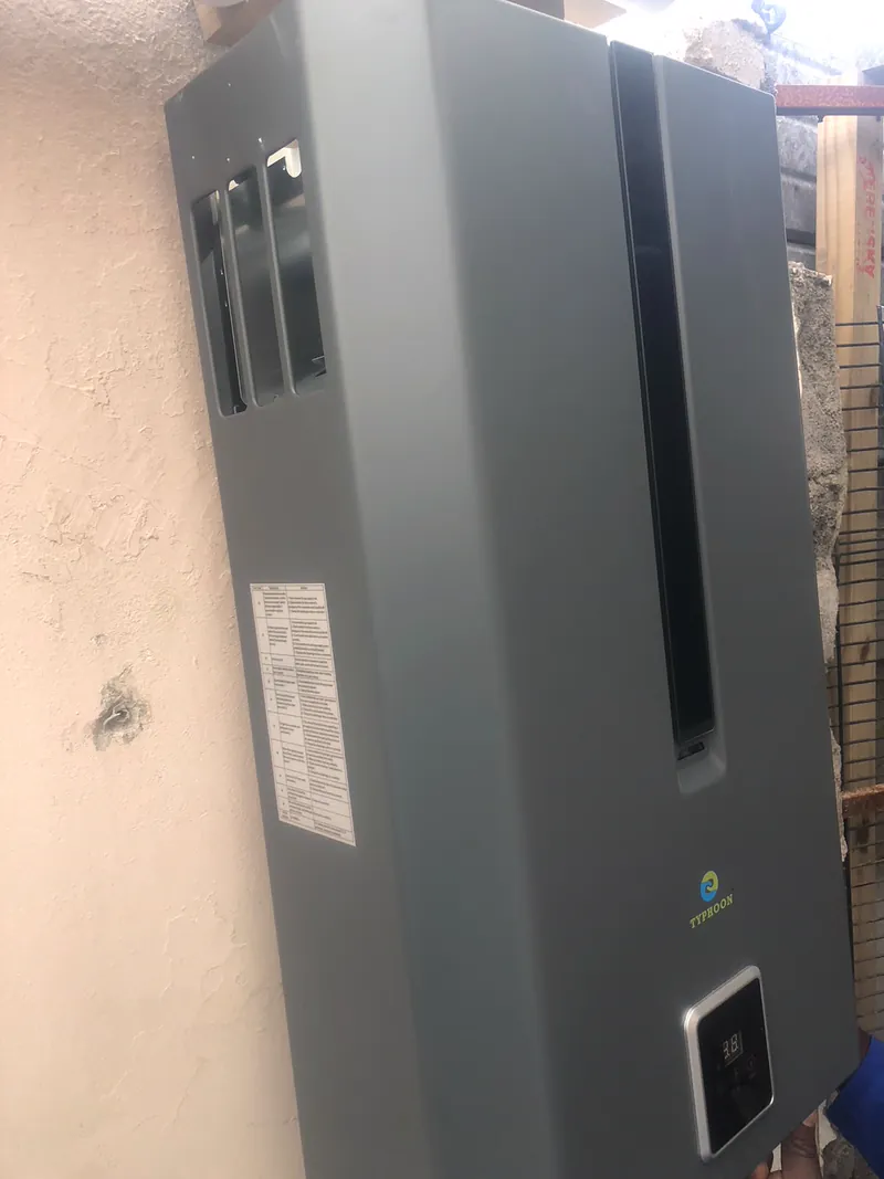 Typhoon gas geyser mounted on a Cape Town wall by Red Flame Gas Supplier, with the digital temperature display fitted
